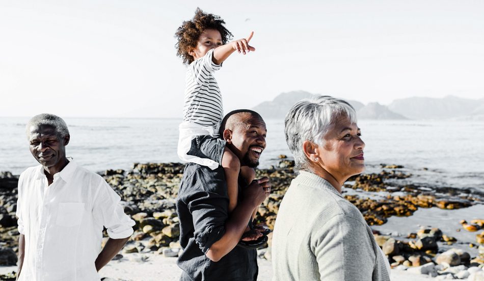 3 Generations walking on beach